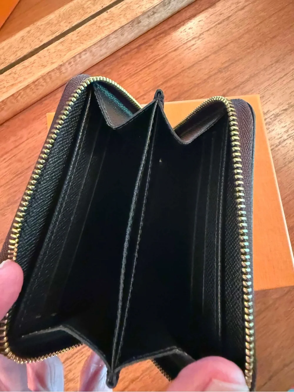 Louis Vuitton Zippy coin purse.